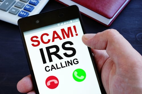 Phone showing IRS scam alert