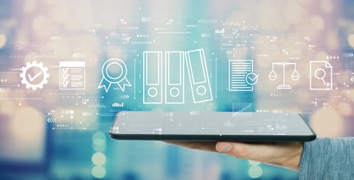 Laptop with graphics of cyber policies on top of it.