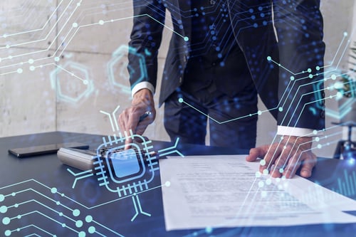 Businessman reviewing legal document with technology graphic overlay