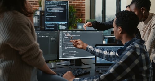 Group of startup team members discussing secure coding practices