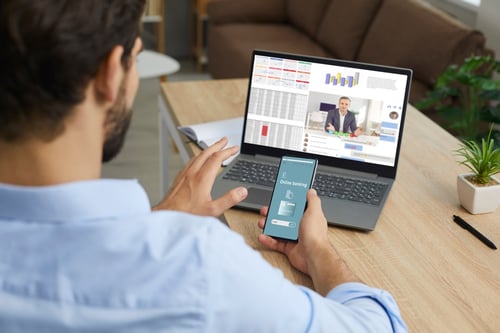 Finance executive reviewing an urgent payment request during a potentially AI-generated video call.