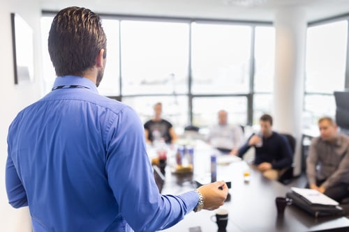 Leader speaking in conference room
