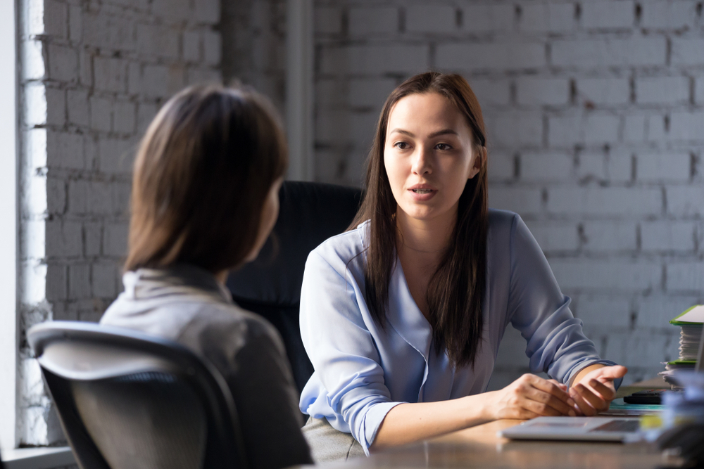 Insurance agent presenting renewal options