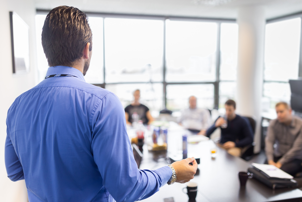 Leader speaking in conference room